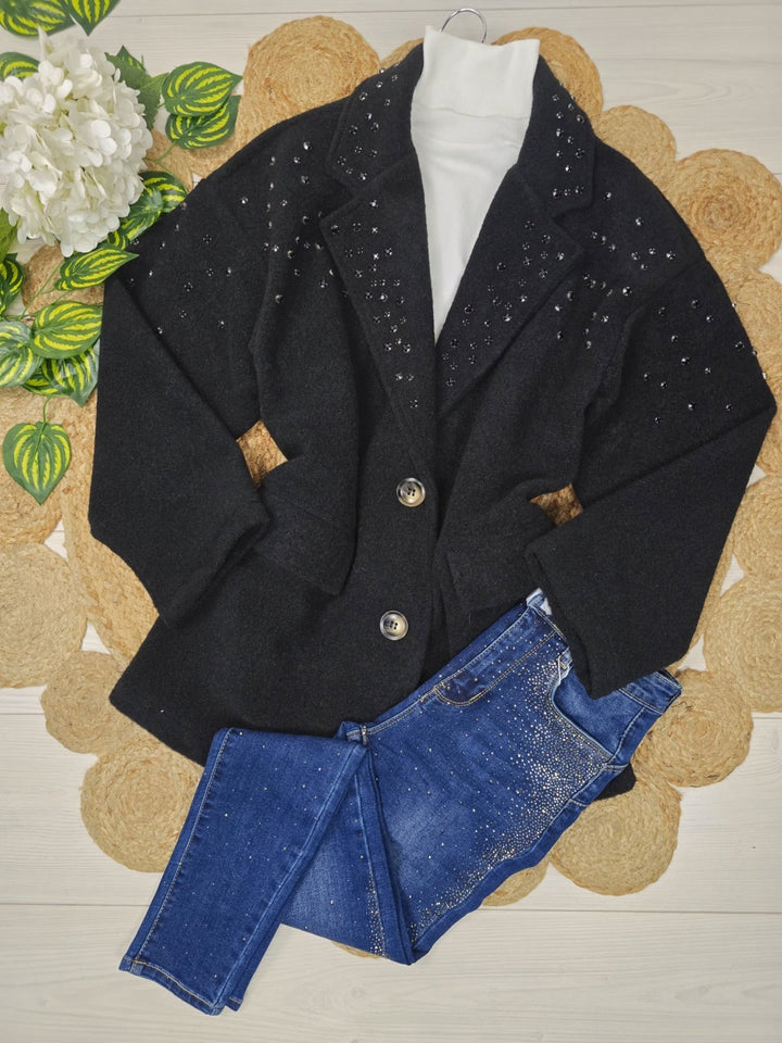 Cappotto in panno con rivetti caratterizzato da chiusura a doppio bottone e tasche laterali Nero Level Stores