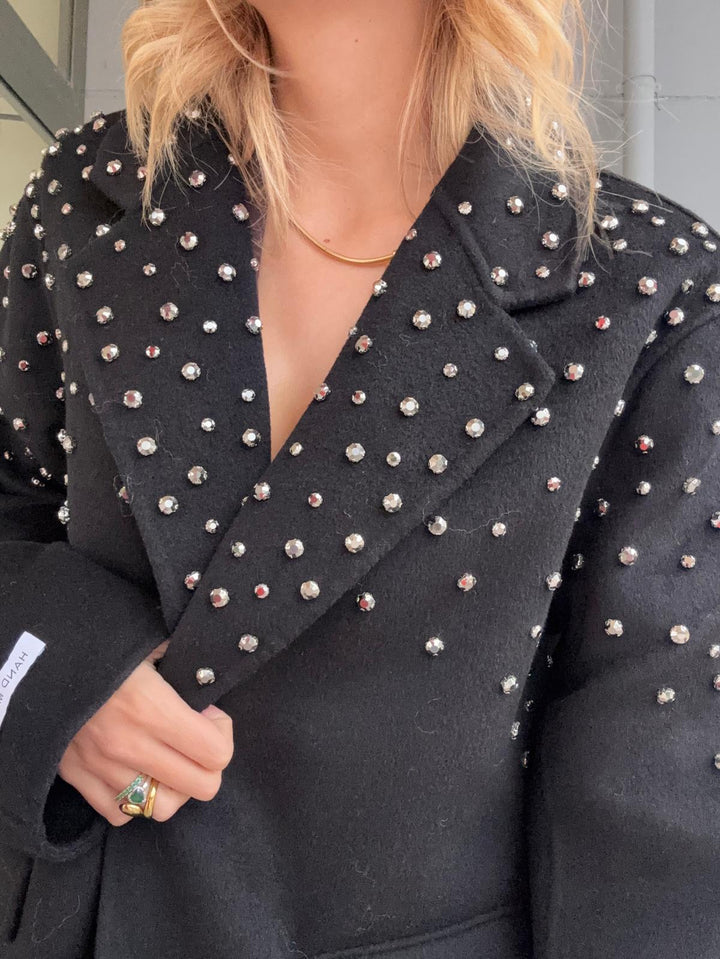 Cappotto in panno con rivetti caratterizzato da chiusura a doppio bottone e tasche laterali Beige Level Stores