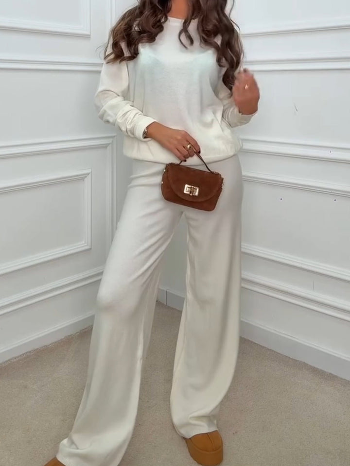 Completo composto da maglia in lana abbinato a pantaloni palazzo con vita elastica Bianco Level Stores