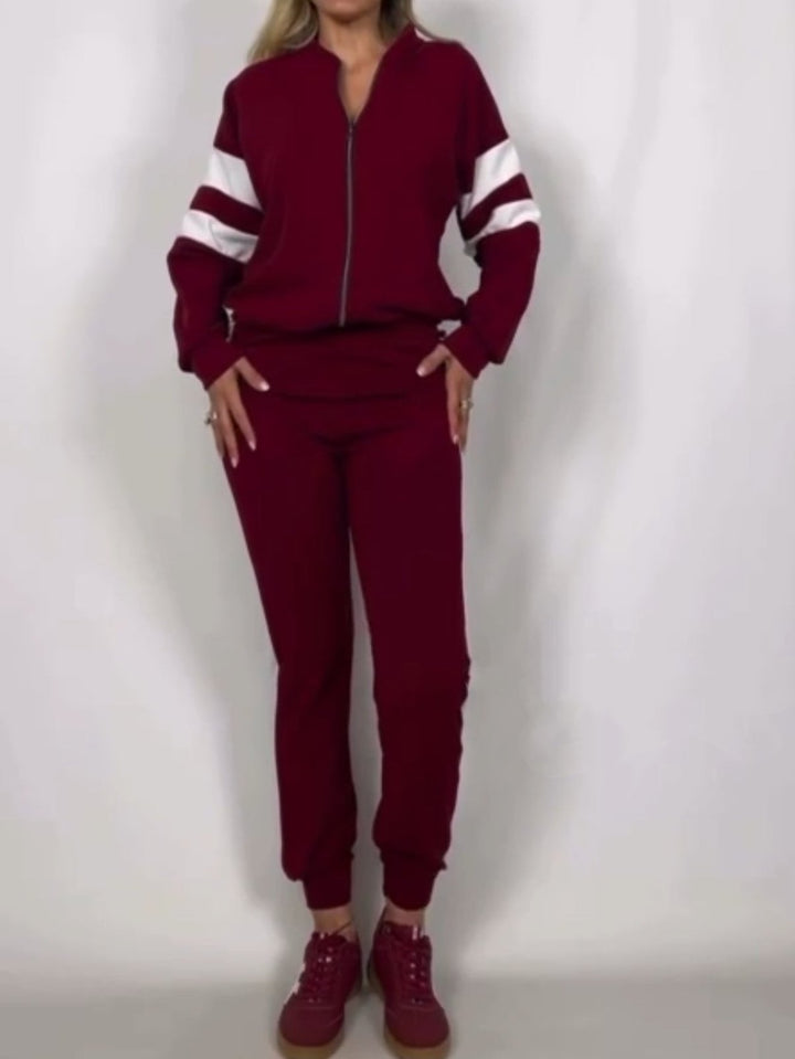 Completo composto da tuta in felpa con zip e pantaloni elastico in vita Bordo Level Stores